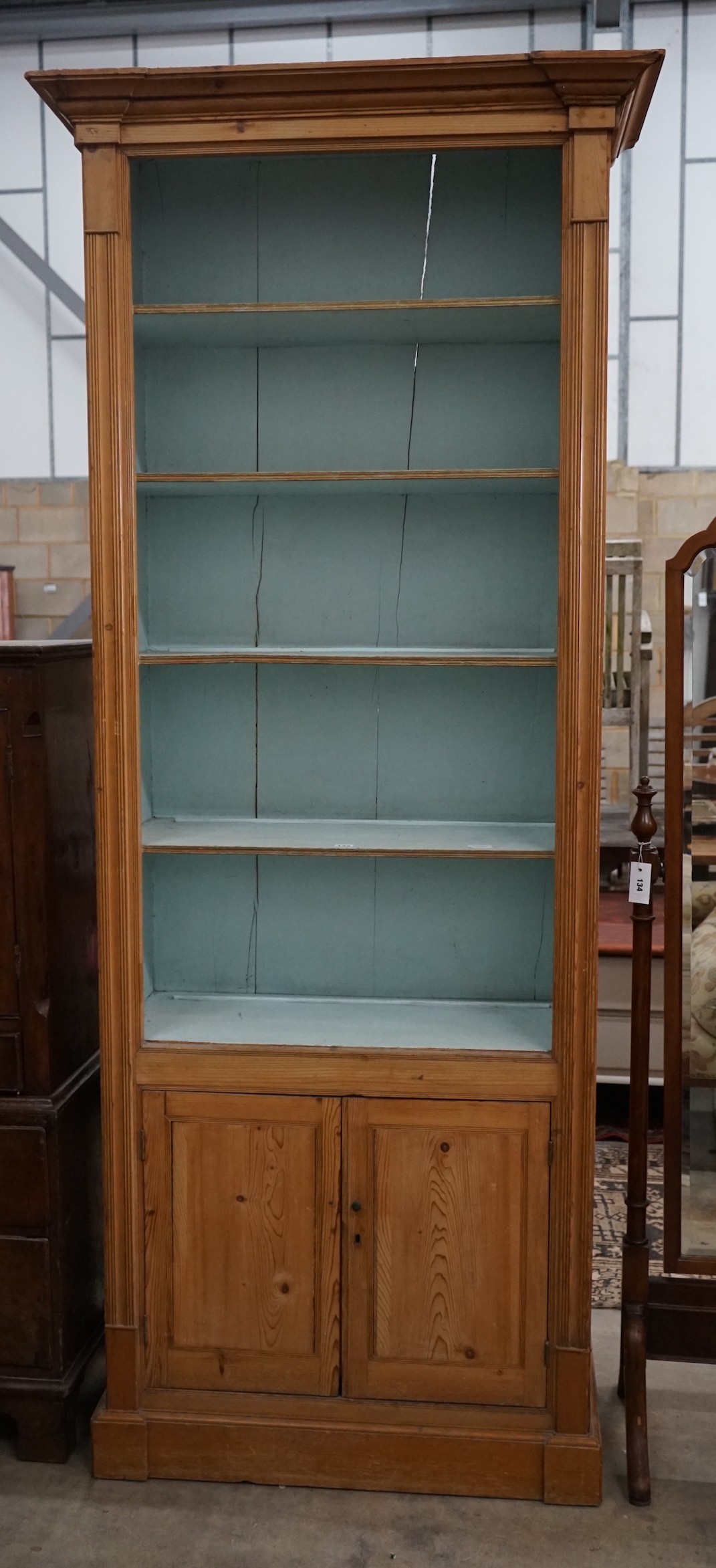 A Victorian pitch pine tall open bookcase, width 90cm, depth 44cm, height 231cm